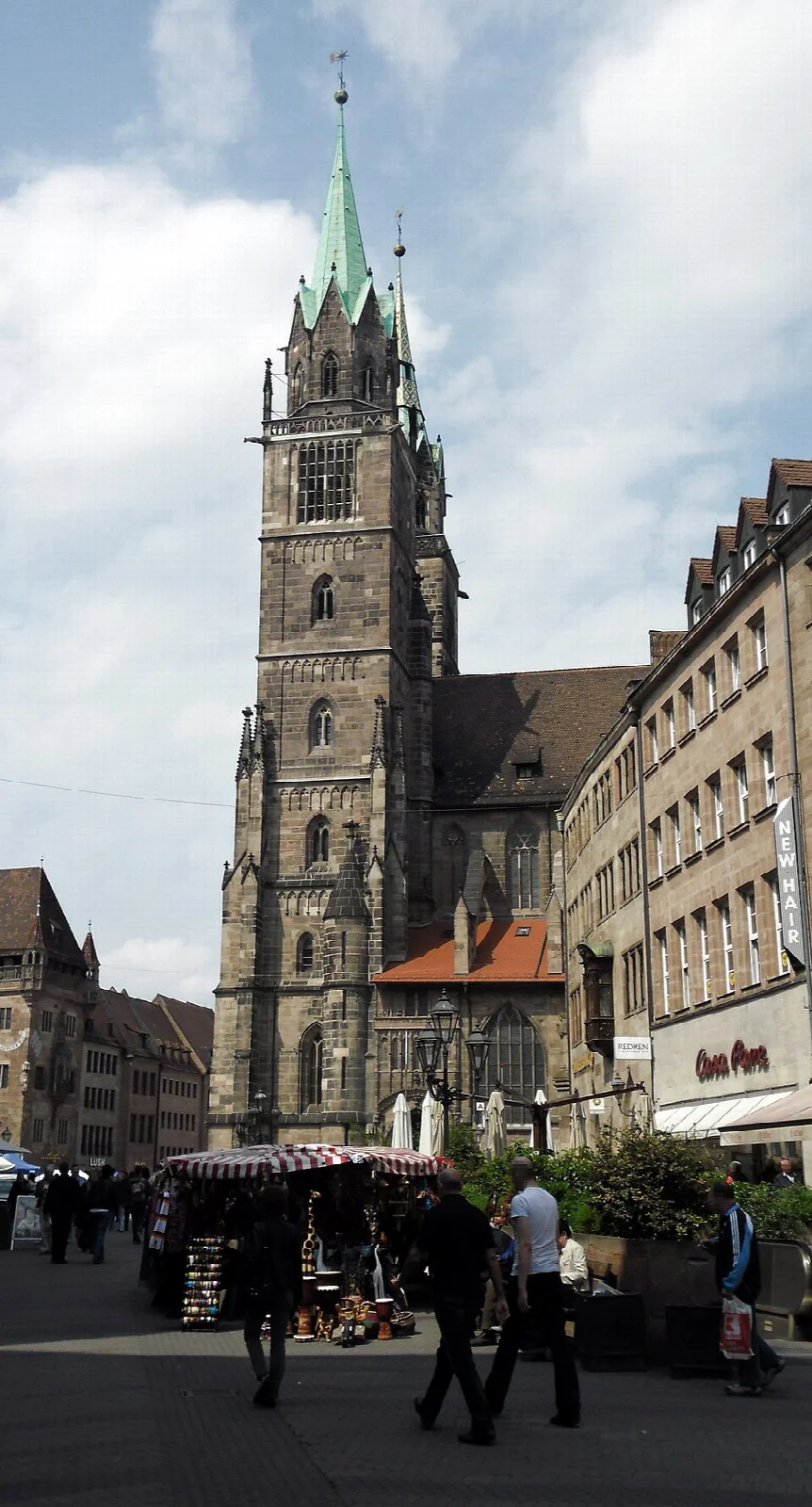 Pointed towers and Gothic west facade of St. Lorenz Church in Nuremberg's Old Town