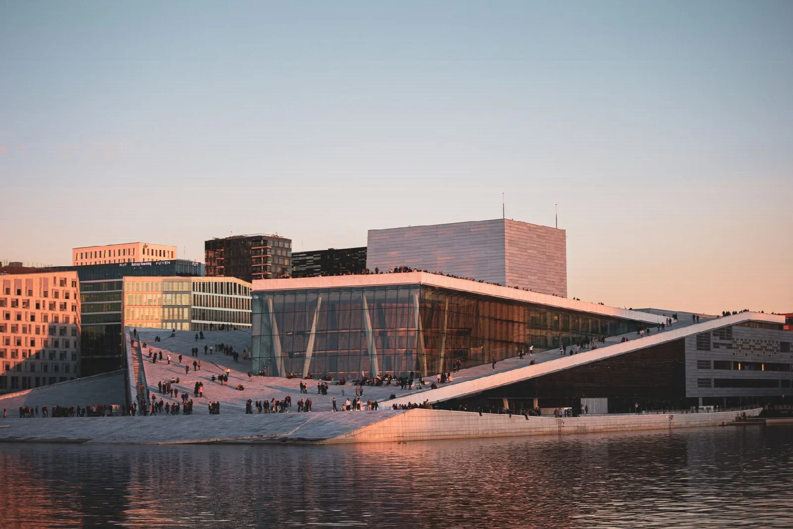 Oslo Opera House and waterfront architecture; real city context for a walk before a meal.