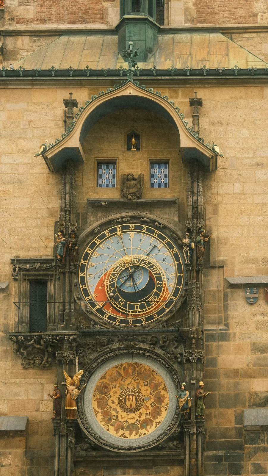 The ornate dial of Prague’s Astronomical Clock and its surrounding stone façade