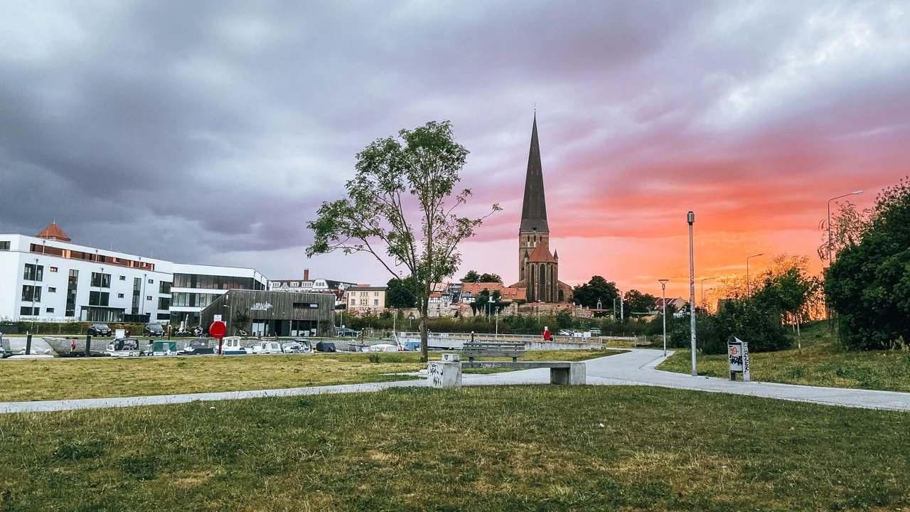 A brick church and open space in the Rostock cityscape