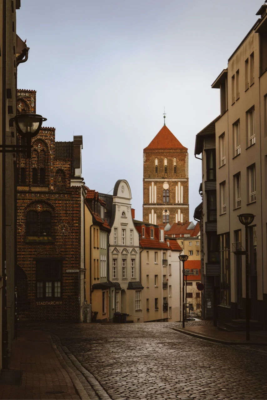 A cobbled street and historic facades in Rostock’s old town