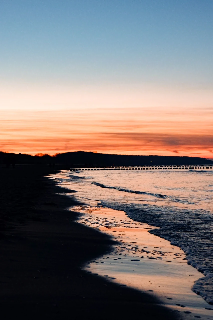 Sunset and small waves on the Rostock coast