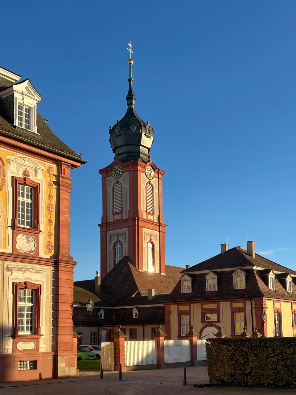 The palace forecourt in Schwetzingen with a church tower behind