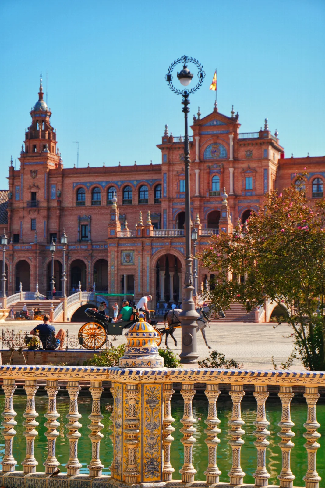 Ornate architecture and the broad square at Plaza de España in Seville