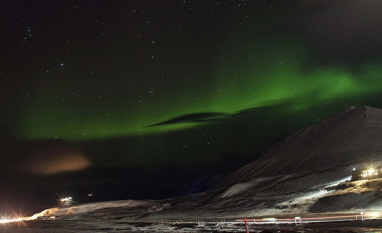 Aurora over Longyearbyen, 26 November 2014; authentic long-exposure photograph, not a visibility guarantee for your visit.