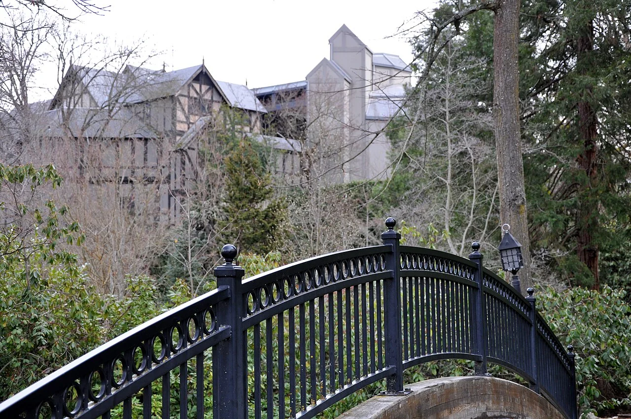 Bridge over Ashland Creek in Lithia Park with OSF exterior buildings behind, February 2013; not a current performance