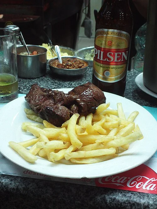 Asado example photographed at La Chacra del Puerto, Mercado del Puerto, Montevideo, 2014; not a current menu recommendation